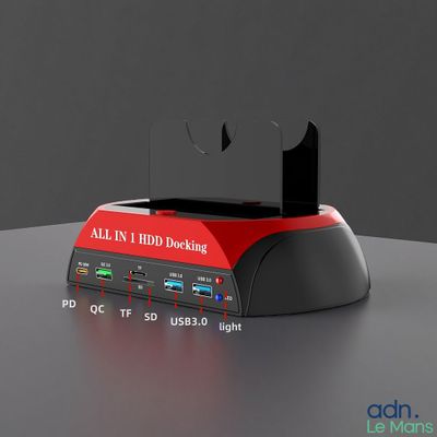 une image représentant un dispositif d'ancrage rouge et noir posé sur une table