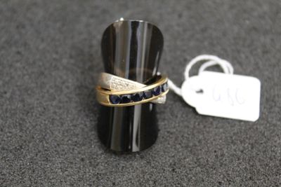 a ring that is sitting on a table next to a tag