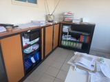 a desk with a bunch of papers on it in a room