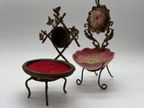 pair of antique brass and glass jewelry stands on a white background