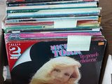 a lot of magazines in a box on the floor