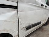 a white van that is parked in a parking lot