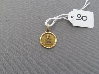 l'image d'une pièce d'or sur laquelle figure le chiffre 90