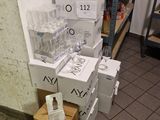 several boxes of water are stacked on top of each other in a room