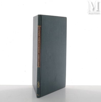 a book sitting on top of a table next to a white wall