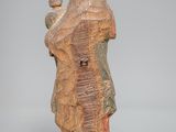 figurine of a woman holding a child in her arms