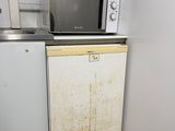 a microwave and a dishwasher in a small kitchen
