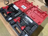 two tools in a red case on a wooden table