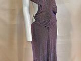 the mannequin is wearing a purple dress on a white mannequin