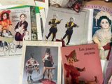 a lot of books on the table with pictures on them