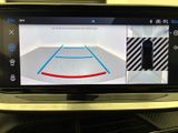 a picture of a car ' s rear view mirror showing a basketball court