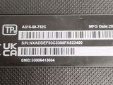 a close up of a black and white label on a black surface