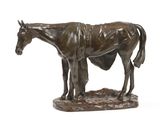 bronze statue of a horse with a blanket on it ' s back