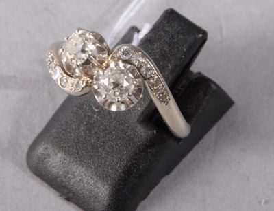 an image of a diamond ring on a black ring holder