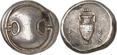 a silver coin with an image of a vase on it
