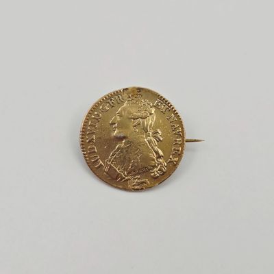 l'image d'une pièce d'or sur laquelle figure une femme