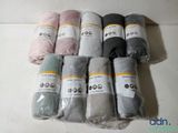 several balls of yarn are wrapped in plastic bags on a table