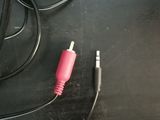 a cable that is connected to a speaker on a table