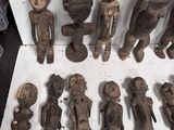 a lot of wooden figurines that are sitting on a table