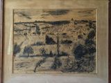 painting of a view of a town in a wooden frame on a wall