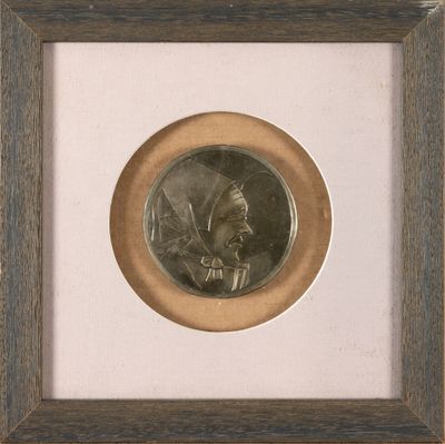 an old picture of a man in a turban is shown in a wooden frame