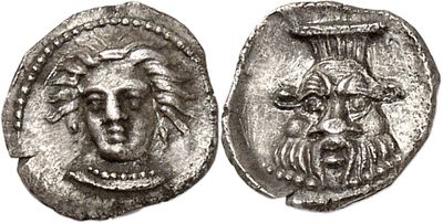 a silver coin with an image of a man ' s face on it