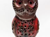 a red owl lamp on a white background