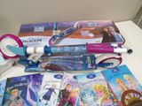 several children ' s books and a scooter are on a table