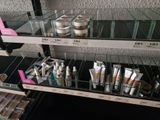 a lot of makeup products on the shelves in the store