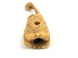 a small wooden object that looks like a cat