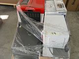 a stack of boxes and a microwave sitting on a pallet