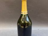 a bottle of wine that is sitting on a table