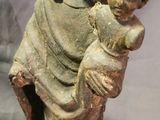 an image of a statue of jesus holding a child