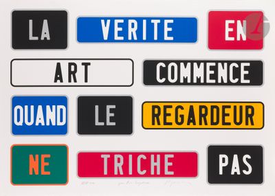 many different colored street signs on a white surface