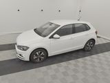 the white car is parked in the garage on the checkered floor