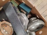 a box full of pots and pans sitting on the floor