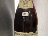 a bottle of wine that is sitting on a table