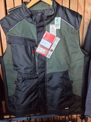 men ' s vests and jackets on display in a store