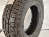 a close up of a tire on a white surface