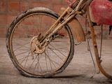 a dirty bike that is parked in a garage