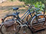 a bike that is parked next to a wooden pallet