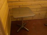 a small table and chair in the corner of a room