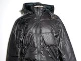 jacket on mannequin dummy in front of a white wall