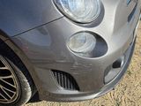 a small car that is parked on the side of the road