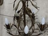 a chandelier that is on the floor in the room