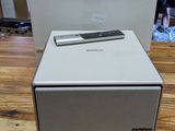 a white box sitting on top of a wooden table