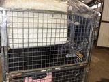 a metal cage with a mattress on top of it