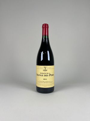 a bottle of red wine sitting on top of a table