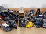 a lot of toy trucks that are on the floor