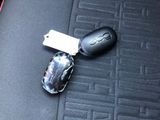 a car key and a mouse on the seat of a car